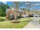 Lovely two-story brick home with mature trees and a well-kept lawn at 3889 Elm Trace Dr, Loganville, GA 30052