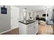 Contemporary kitchen with island, granite countertops, and eat in bar at 3889 Elm Trace Dr, Loganville, GA 30052