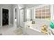 Relaxing main bathroom with soaking tub, separate shower, and ample natural light from a window at 3889 Elm Trace Dr, Loganville, GA 30052