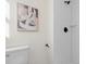 This bathroom features a neutral wall color, modern fixtures, and a white subway tile shower at 9347 Haley Ct, Jonesboro, GA 30238