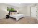 This primary bedroom features a neutral color palette, plush carpet, and great light from the window at 9347 Haley Ct, Jonesboro, GA 30238