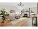 Bright and inviting living room with vaulted ceilings, modern decor, and a cozy fireplace at 9347 Haley Ct, Jonesboro, GA 30238