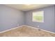Bright bedroom with carpet, featuring a window for plenty of natural light at 108 Dove, Peachtree City, GA 30269