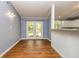 Well lit dining area with hardwood floors and French doors leading to the backyard at 108 Dove, Peachtree City, GA 30269