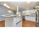 Bright kitchen with granite countertops, stainless steel appliances, and open layout at 108 Dove, Peachtree City, GA 30269