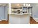 Bright kitchen with breakfast bar, stainless steel appliances, and granite countertops at 108 Dove, Peachtree City, GA 30269