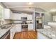Modern kitchen with white cabinetry, stainless steel appliances, and granite countertops at 108 Dove, Peachtree City, GA 30269