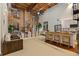 Spacious open-concept living space with exposed brick, modern kitchen, dining area, and high ceilings at 170 Boulevard Se # 115E, Atlanta, GA 30312