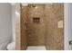 The bathroom has a tiled shower with a built-in niche and modern fixtures at 3655 Habersham Ne Rd # B-254, Atlanta, GA 30305