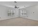 Bright bedroom with carpeting, ceiling fan, and two large windows at 3655 Habersham Ne Rd # B-254, Atlanta, GA 30305