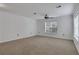 Spacious bedroom with carpet, ceiling fan, and two windows at 3655 Habersham Ne Rd # B-254, Atlanta, GA 30305