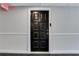 A secure, classic black front door providing secure entry to the building at 3655 Habersham Ne Rd # B-254, Atlanta, GA 30305