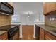 Open kitchen with stainless steel appliances and view of living room at 3655 Habersham Ne Rd # B-254, Atlanta, GA 30305