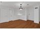 Living room showcasing hardwood floors and closet space, providing ample storage at 3655 Habersham Ne Rd # B-254, Atlanta, GA 30305