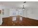 Spacious living area with gleaming hardwood floors, two large windows, and ceiling fan at 3655 Habersham Ne Rd # B-254, Atlanta, GA 30305