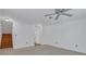 Living room featuring a ceiling fan, carpet floors, and a staircase at 3655 Habersham Ne Rd # B-254, Atlanta, GA 30305