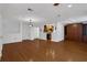 Open living space with hardwood floors, showcasing kitchen access and built-in cabinetry at 3655 Habersham Ne Rd # B-254, Atlanta, GA 30305