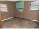 Empty bedroom with a wood floor and damaged walls at 4758 Highway 81, Mcdonough, GA 30252