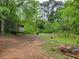 Exterior of the property shows a trailer and natural surroundings at 4758 Highway 81, Mcdonough, GA 30252