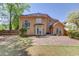 Spacious backyard with stone patio, manicured lawn, and mature trees at 4766 Cedar Wood Sw Dr, Lilburn, GA 30047