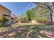 Large backyard with a shed, green grass, patio, and perimeter wooden fence at 4766 Cedar Wood Sw Dr, Lilburn, GA 30047