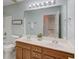 Bathroom featuring a double sink vanity, toilet, and shower/tub combo at 4766 Cedar Wood Sw Dr, Lilburn, GA 30047