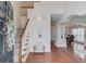 Inviting foyer with hardwood floors, staircase, and decorative niche at 4766 Cedar Wood Sw Dr, Lilburn, GA 30047