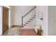Entryway with hardwood floors and a staircase with natural light at 4766 Cedar Wood Sw Dr, Lilburn, GA 30047