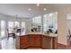 Kitchen island view to living room and breakfast area with large windows at 4766 Cedar Wood Sw Dr, Lilburn, GA 30047