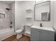 Modern bathroom showcasing a tub-shower, elegant fixtures, and sleek vanity with stylish mirror at 492 Mary Hill Ln, Douglasville, GA 30134