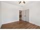 Well-lit bedroom showcasing hardwood floors, white trim, and an open doorway to the hall at 492 Mary Hill Ln, Douglasville, GA 30134