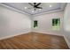 Spacious bedroom featuring tray ceilings, recessed lighting, hardwood floors and plenty of natural light at 492 Mary Hill Ln, Douglasville, GA 30134