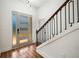 Stylish entryway featuring wood floors, modern door with glass inserts, and unique staircase railing design at 492 Mary Hill Ln, Douglasville, GA 30134