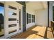 Welcoming front porch with modern door and sidelight, showcasing sleek design and inviting outdoor space at 492 Mary Hill Ln, Douglasville, GA 30134