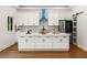 Close up of the kitchen with white cabinets, stainless steel appliances, marble countertops, and modern fixtures at 492 Mary Hill Ln, Douglasville, GA 30134
