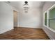 Bright living room featuring modern light fixture and hardwood flooring, with great window views at 492 Mary Hill Ln, Douglasville, GA 30134