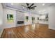 Open concept area features wood floors, fireplace, and a modern kitchen at 492 Mary Hill Ln, Douglasville, GA 30134
