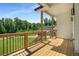 Spacious porch featuring wood flooring and black iron railings, offering a perfect outdoor retreat with serene views at 492 Mary Hill Ln, Douglasville, GA 30134