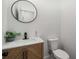Chic powder room featuring a decorative mirror, modern vanity, and stylish fixtures at 492 Mary Hill Ln, Douglasville, GA 30134