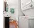 Bathroom with wood-look floors, a vanity, and stacked washer/dryer at 6149 Josephine Rd, Atlanta, GA 30340