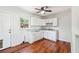 Bright eat-in kitchen featuring white cabinets, granite countertops, and modern appliances at 6149 Josephine Rd, Atlanta, GA 30340
