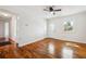 Bright living room featuring hardwood floors, a front door, and fresh white walls at 6149 Josephine Rd, Atlanta, GA 30340