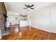 Open-concept living room with hardwood floors, fireplace, and easy access to the kitchen at 6149 Josephine Rd, Atlanta, GA 30340