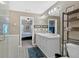Bathroom with double sink vanity and glass enclosed shower at 706 Woodland Pl, Woodstock, GA 30188