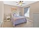 Bedroom featuring a bed, window with curtains, and overhead fan at 706 Woodland Pl, Woodstock, GA 30188