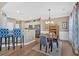 Eat in kitchen with dining table, stainless steel appliances, and breakfast bar at 706 Woodland Pl, Woodstock, GA 30188