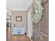Welcoming entryway with console table, wreath, and wood flooring at 706 Woodland Pl, Woodstock, GA 30188