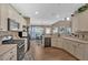 Bright eat-in kitchen featuring stainless steel appliances and eat-in dining area at 706 Woodland Pl, Woodstock, GA 30188