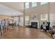 Open-concept living room featuring a fireplace and hardwood floors at 706 Woodland Pl, Woodstock, GA 30188