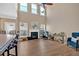 Spacious living room with fireplace, tall ceilings, and an abundance of natural light at 706 Woodland Pl, Woodstock, GA 30188